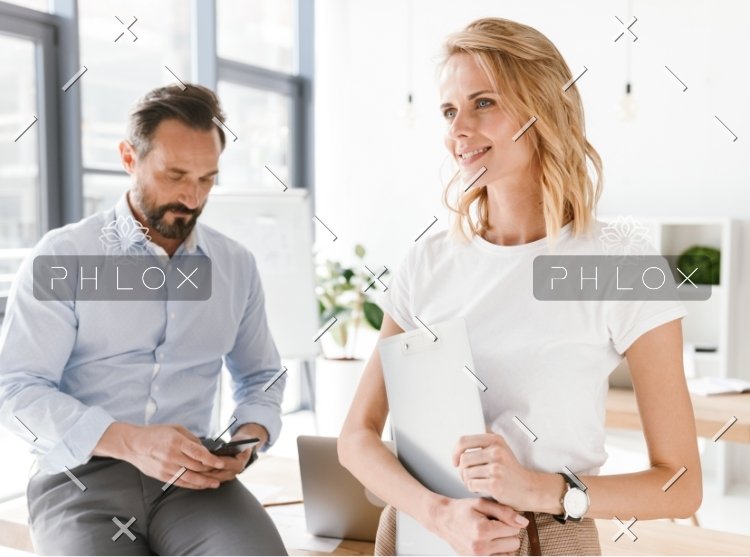 demo-attachment-328-confident-man-manager-using-mobile-phone-PKUB4RV@2x